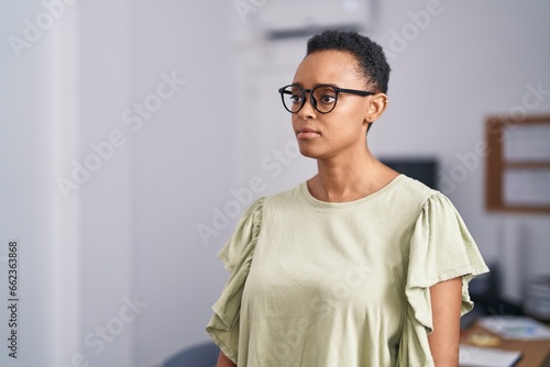 African american woman business worker standing with serious expression at office