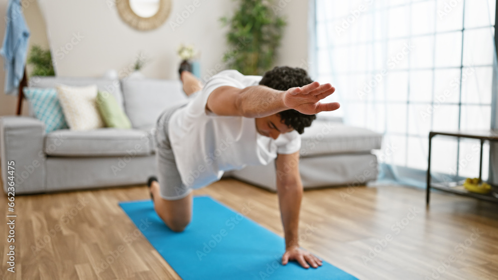 Young latin man training core exercise at home Young latin man training core exercise at home