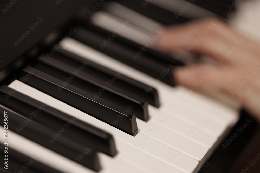 Fototapeta premium Keyboard player hand, close up view, abstract detail