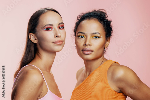 American woman two race model together skin beautiful colorful african beauty mixed make-up happy studio