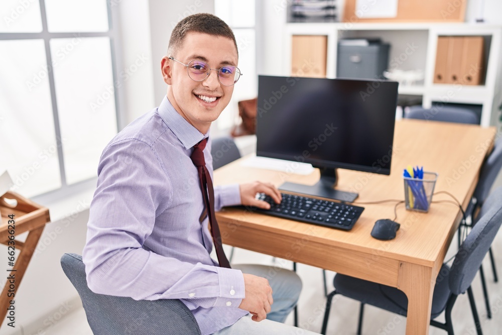Young hispanic man business worker using computer working at office