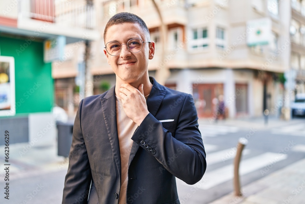 Young hispanic man executive having throat pain at street Young hispanic man executive having throat pain at street