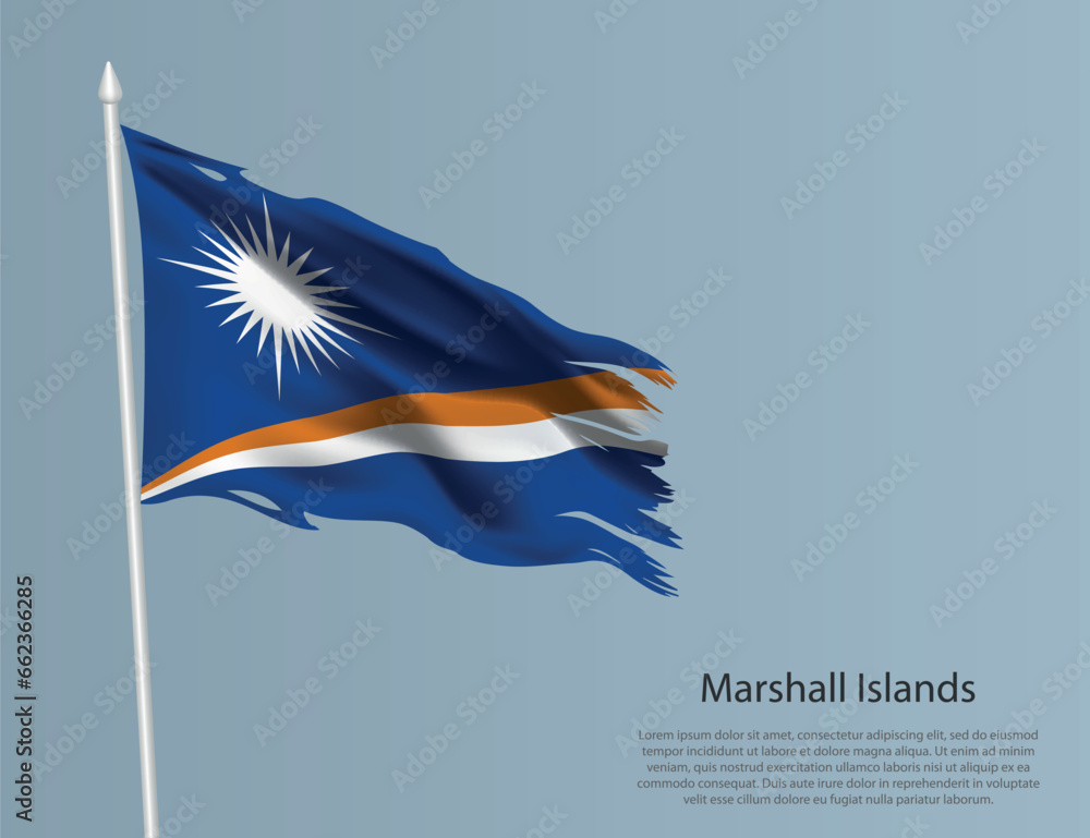 Ragged national flag of Marshall Islands. Wavy torn fabric on blue background.