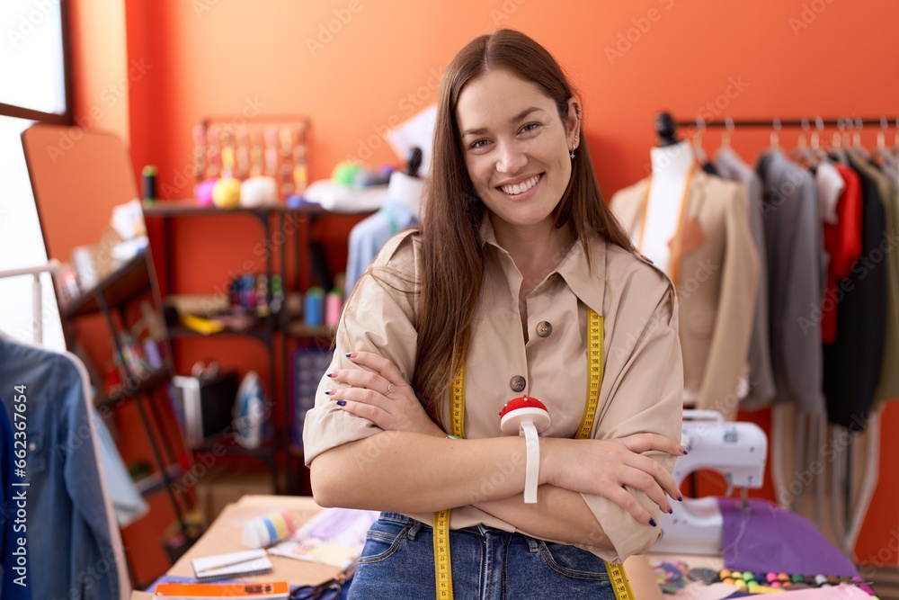 Young beautiful woman tailor smiling confident standing with arms crossed gesture at atelier