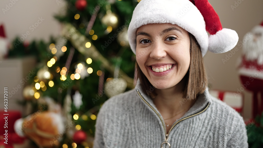 Young beautiful hispanic woman smiling confident standing by christmas tree at home Young beautiful hispanic woman smiling confident standing by christmas tree at home