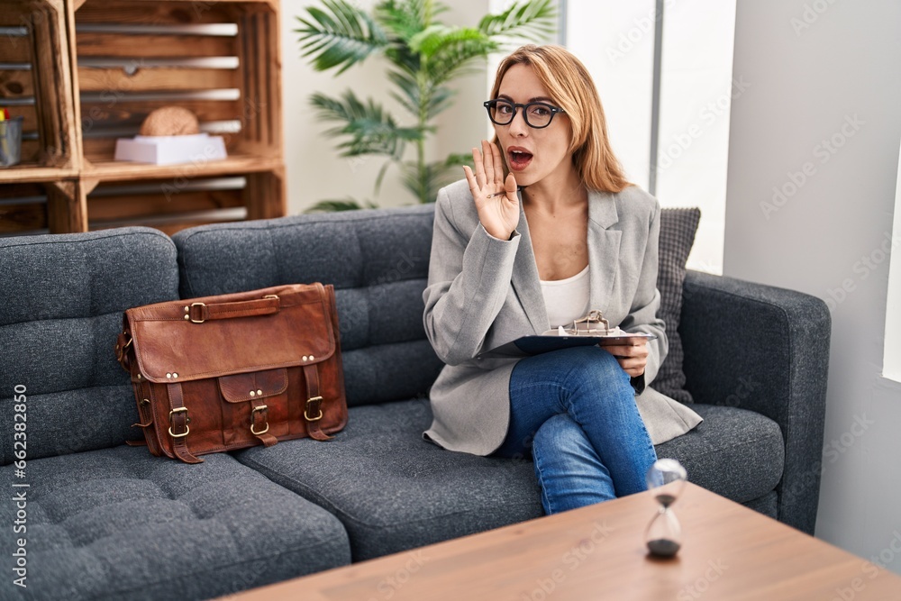 Hispanic woman working at consultation office hand on mouth telling secret rumor, whispering malicious talk conversation Hispanic woman working at consultation office hand on mouth telling secret rumor, whispering malicious talk conversation