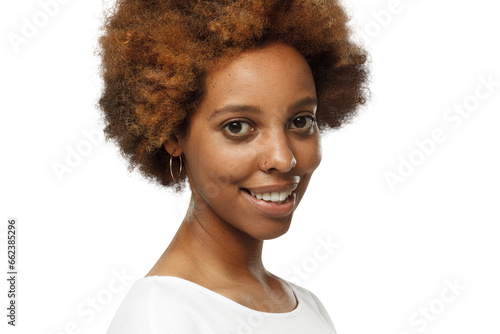 Close-up portrait of smiling young african american woman wearing white t-shirt photo