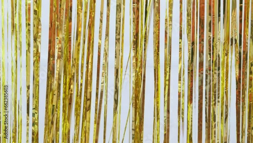 Shimmering golden foil tinsel fringe background for stage New Year party, event