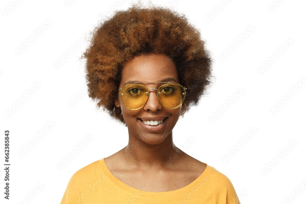 Close-up portrait of smiling young african american woman wearing t-shirt and yellow sunglasses