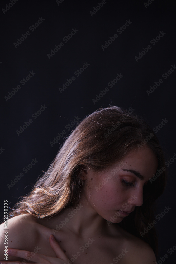 Vertical portrait of young girl on dark background Vertical portrait of young girl on dark background