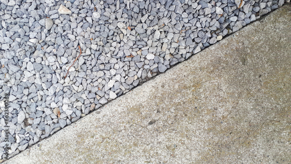Close-up capture of half exposed cement stone revealing intricate gravel details. Close-up capture of half exposed cement stone revealing intricate gravel details.