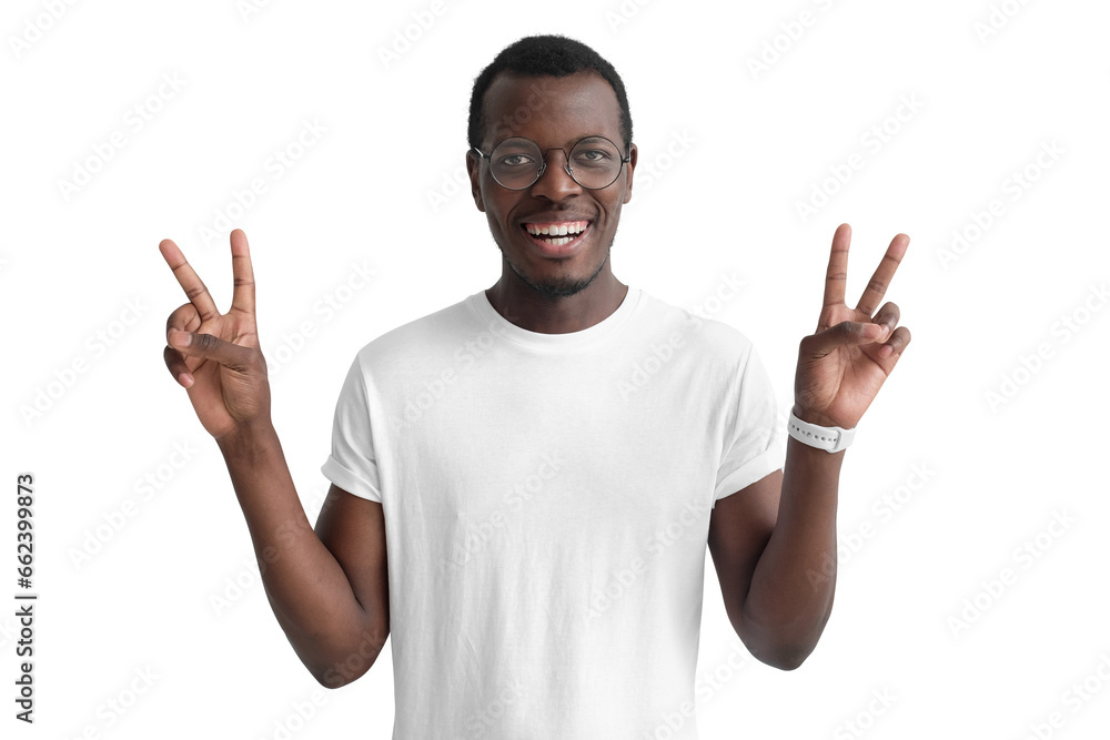 Young african man showing victory gesture with both hands