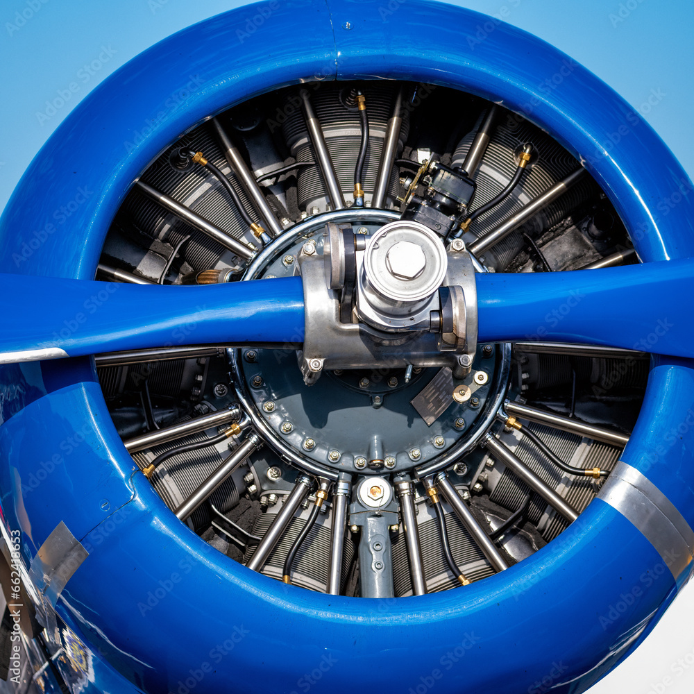 Close up of a small airplane prop and engine