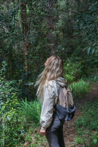 Woman is enjoying walking through the tropical rainforest of Madagascar © Alexey Pelikh