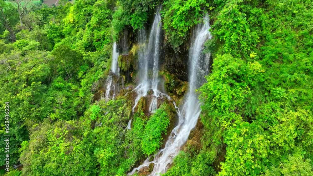 Discover harmony in nature's triple cascade, tucked away in a vibrant rainforest. Drone view reveals the symphony of water and jungle in perfect harmony. Rainforest Paradise: Exotic biodiversity.
Discover harmony in nature's triple cascade, tucked away in a vibrant rainforest. Drone view reveals the symphony of water and jungle in perfect harmony. Rainforest Paradise: Exotic biodiversity.