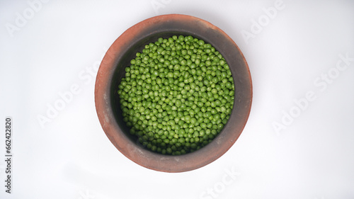 Grain green fresh peas white background, isolated, organic peas photo idea concept, peas in a tile pot, beautiful in casserole.