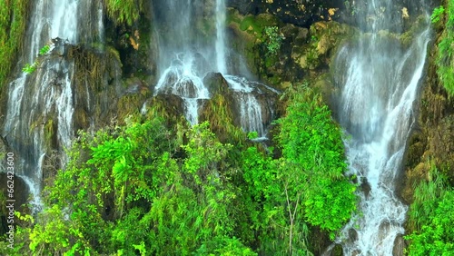 Enchanting Aerial View: Explore the mystical magic waterfall tucked away in a lush, emerald tropical rainforest. A hidden gem waiting to be discovered. Tropics' green oasis. Thailand.
