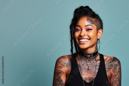 Young woman with neck and face tattoos happy smiling laughing photo