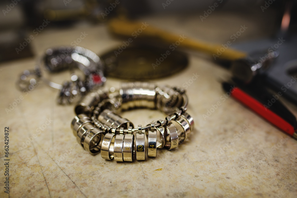 Workshop with goldsmith's tools and finger sizing gauges which are used to determine finger size. Workshop with goldsmith's tools and finger sizing gauges which are used to determine finger size.