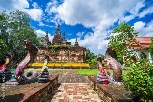 Wat Chet Yot or Wat Photharam Maha Wihan, seven pagoda temple It is a major tourist attraction in Chiang Mai, Thailand.with evening,Temple in Chiang Mai. photo