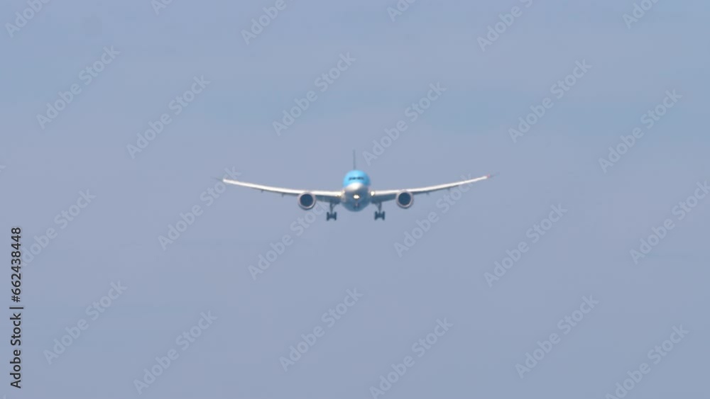 Airplane approaching for landing, bottom view. Jet passenger plane flies. Footage of aircraft descending. Aircraft in the sky. Tourism and travel concept Airplane approaching for landing, bottom view. Jet passenger plane flies. Footage of aircraft descending. Aircraft in the sky. Tourism and travel concept