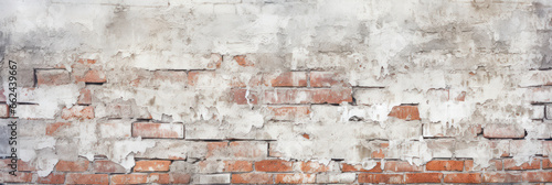 Old brick wall with damaged plaster and white paint texture background