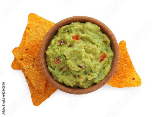 Bowl of delicious guacamole with nachos chips isolated on white, top view