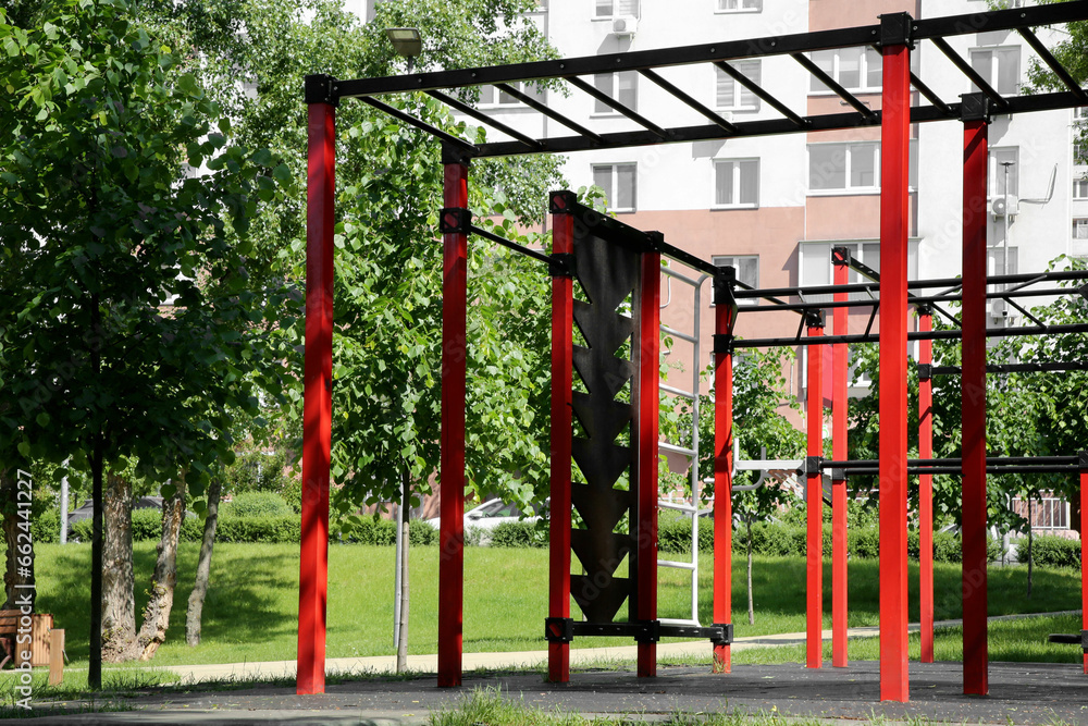 Empty outdoor gym with exercise equipment in park Empty outdoor gym with exercise equipment in park