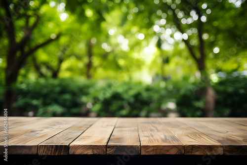 Wooden outdoors table on forest background