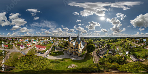 aerial full hdri 360 panorama view on white neo gothic catholic church in countryside or village in equirectangular projection with zenith and nadir. VR AR content