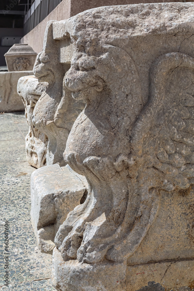 Ancient marble figures of gryphon. Close up, vertical. Izmir, Turkey