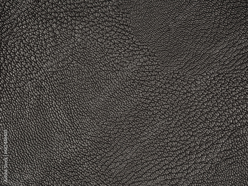 Texture of black leather clothing fabric selective focus