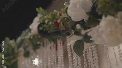 Wedding arch with flowers and beads close-up