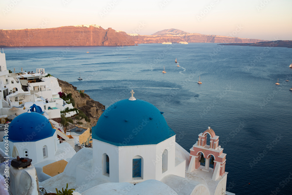 Beautiful coastal landscape with blue dome church and Mediterranean Sea coast in Santorini, Greek Island