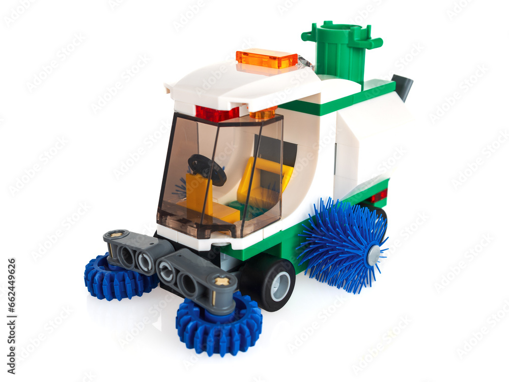 Children's game constructor for assembling models from parts, cleaning car, selective focus, isolated on a white background