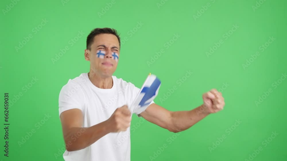 Man cheering for Finland waving a national flag looking away Man cheering for Finland waving a national flag looking away