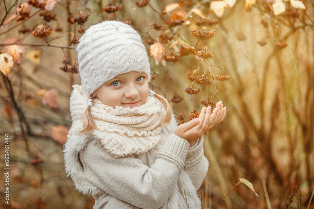 Portrait of a smiling young girl in an autumn park. Portrait of a smiling young girl in an autumn park.