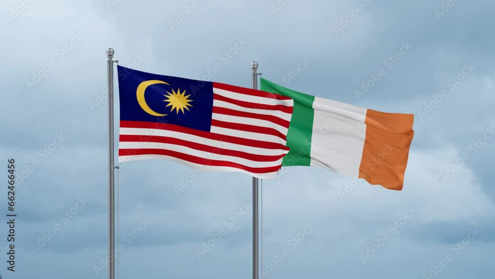 Ireland flag and Malaysia flag waving together on cloudy sky, endless seamless loop, two country relations concept Ireland flag and Malaysia flag waving together on cloudy sky, endless seamless loop, two country relations concept