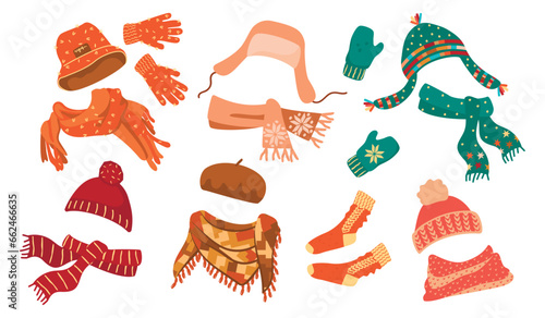 Winter accessories set.Collection of warm cozy things for cold weather. Knitted hats, scarves, gloves, mittens, beret, socks.Colorful clothes isolated on white background.Vector cartoon illustration.