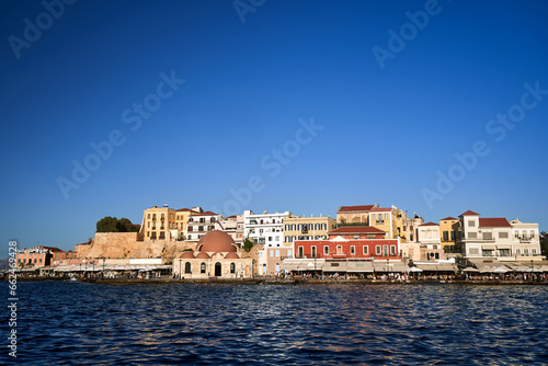 Taverns, historic buildings and crowds of tourists in the port of Chania on the island of Crete