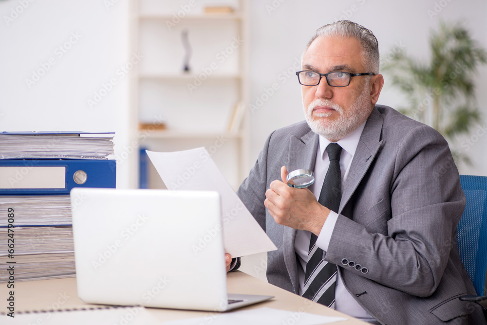 Old male employee and too much work in the office Old male employee and too much work in the office