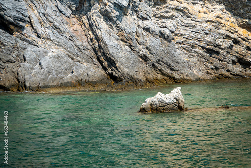 Rocky coast of the island of Sardinia in the Mediterranean Sea photo