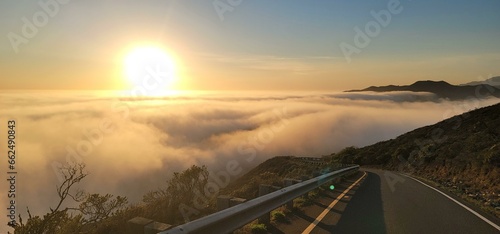 Sunrise Above the Clouds on a Mountain Road Near the Bay © Theo