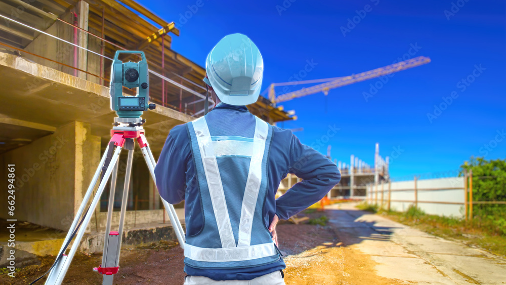man-surveyor-worker-at-construction-site-surveyor-stands-with-his