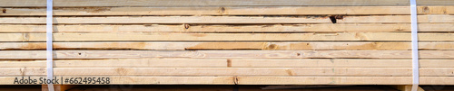 Side view of a stack of lumber, materials for building a new house 