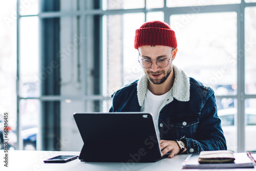 Freelancer using laptop at workplace © BullRun