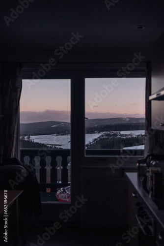 view on the snowy mountains through window