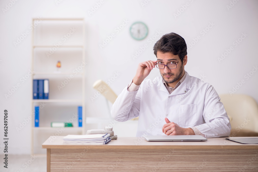 Young male doctor working in the clinic Young male doctor working in the clinic