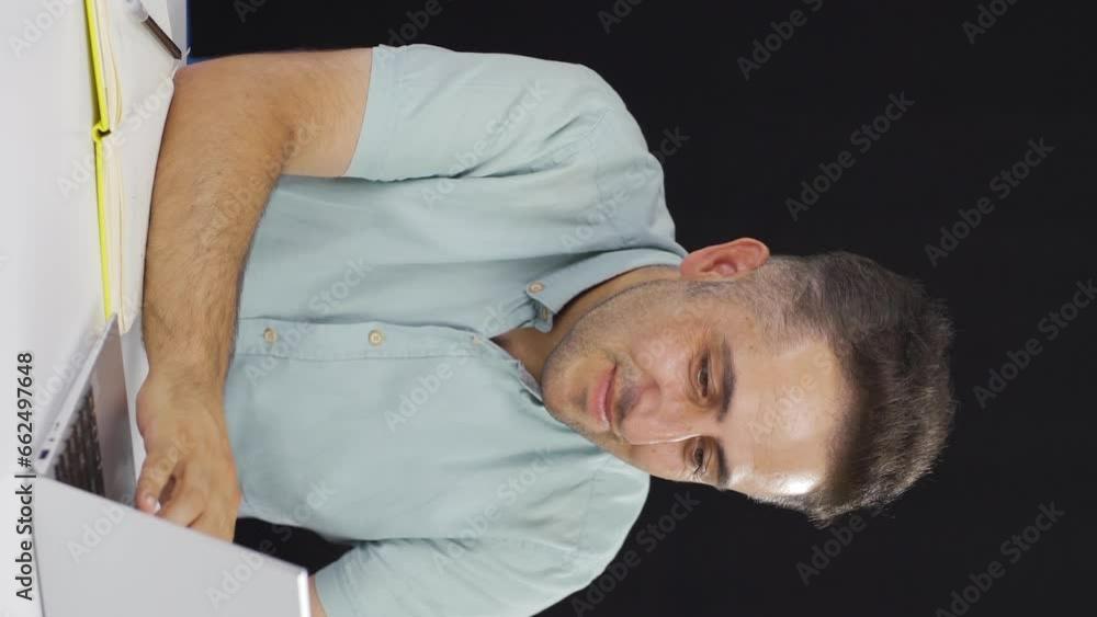 Vertical video of Man chatting on laptop. Vertical video of Man chatting on laptop.