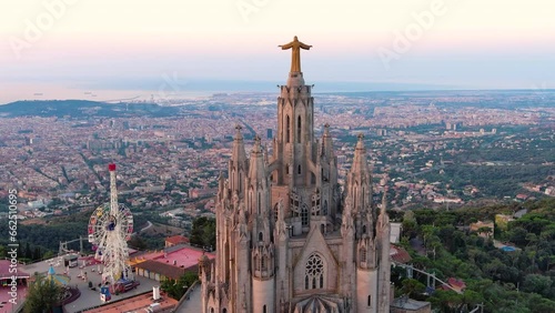 Aerial view of Barcelona skyline with the Expiatory Church of the Sacred Heart of Jesus at sunrise. Tibidabo mountain. Catalonia, Spain photo